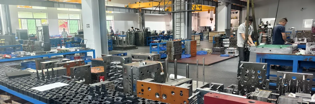 Mold assembly team fitting plastic injection mold plates at Shiny Mold